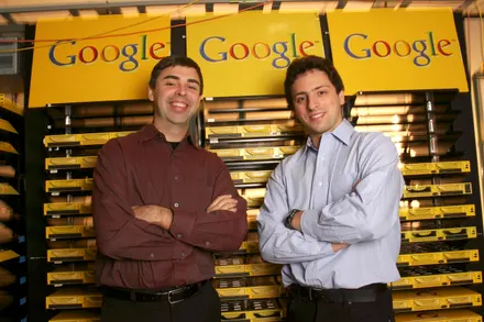 Two men standing in front of Google servers.